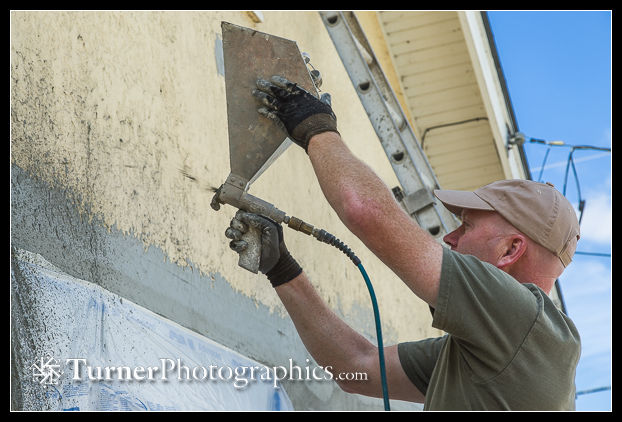 Mark Sager sprays stucco