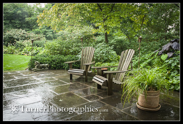 Garden chairs on awet flagstone patio