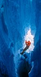 0203344 Craig Butler prusiks up rope in glacial crevasse. Mt. Baker Rec. Area Easton Glacier, WA. © Mark Turner