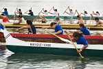 0504332 Boys & girls (junior buckskins 13 & under) paddle 11-man canoes at start, Lummi Stommish canoe races. Lummi Nation, WA. © Mark Turner