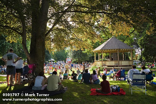 0505707 Maggie's Fury performing in Elizabeth Park bandstand w/ listeners on lawn fgnd. Bellingham, WA. © Mark Turner