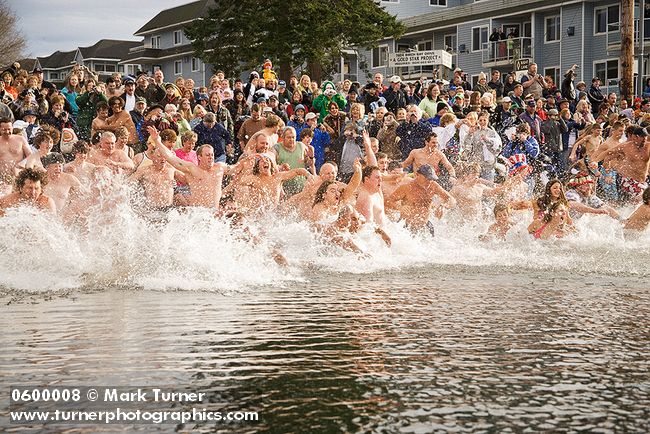 0600008 Polar Bear Swim participants plunge into Birch Bay. Birch Bay, WA. © Mark Turner