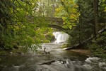 0608347 Whatcom Falls framed by stone bridge, autumn [Acer circinatum; A. macrophyllum]. Bellingham, Whatcom Falls Park, WA. © Mark Turner