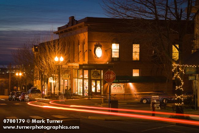 0700179 Renaissance Celebration & Archer Ale House at corner of 10th St & Harris Ave at dusk w/ car taillight streaks. Bellingham, Fairhaven district, WA. © Mark Turner