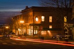 0700179 Renaissance Celebration & Archer Ale House at corner of 10th St & Harris Ave at dusk w/ car taillight streaks. Bellingham, Fairhaven district, WA. © Mark Turner