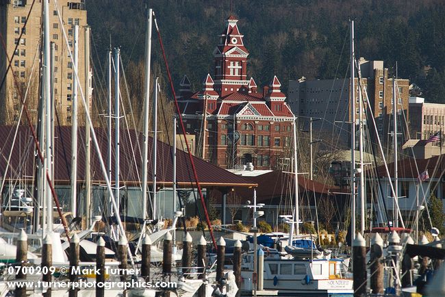 0700209 Whatcom Museum viewed through sailboats in Squalicum Harbor. Bellingham, WA. © Mark Turner