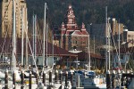 0700209 Whatcom Museum viewed through sailboats in Squalicum Harbor. Bellingham, WA. © Mark Turner