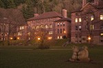 0700382 Old Main w/ sculpture 'The Man Who Used to Hunt Cougars for Bounty' (Richard Beyer) fgnd, dusk. Bellingham, Western Washington University, WA. © Mark Turner