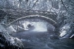 9612408 Stone foot bridge below Whatcom Falls w/ snow fr downstream. Bellingham, Whatcom Falls Park, WA. © Mark Turner