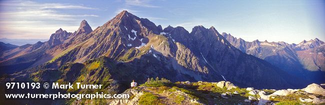 9710193 Canadian Border, American Border Peaks, Mt. Larrabee fr Winchester lookout w/ hiker late afternoon. Mt. Baker Wilderness Winchester, WA. © Mark Turner