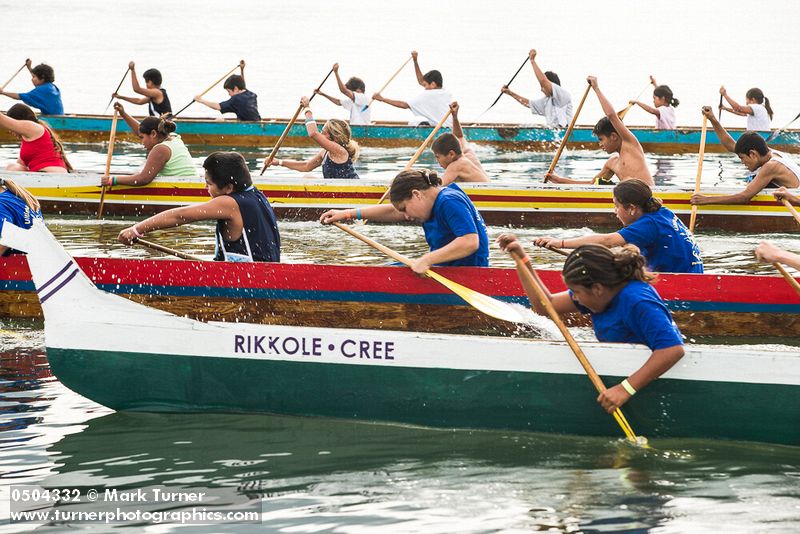 0504332 Boys & girls (junior buckskins 13 & under) paddle 11-man canoes at start, Lummi Stommish canoe races. Lummi Nation, WA. © Mark Turner