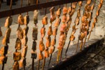 0504383 Barbequed salmon cooking, Lummi Stommish. Lummi Nation, WA. © Mark Turner