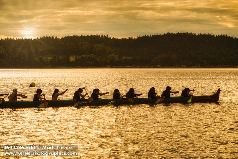 0603586 Boys & girls (junior buckskins) paddle 11-man canoe, Lummi Stommish canoe races. Lummi Nation, WA. © Mark Turner