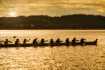 0603586 Boys & girls (junior buckskins) paddle 11-man canoe, Lummi Stommish canoe races. Lummi Nation, WA. © Mark Turner