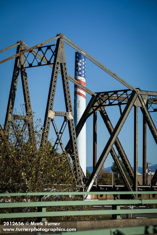 Ferndale Carnation Condensary smokestack framed by BNSF railroad bridge. Ferndale, WA. © Mark Turner [2012656]