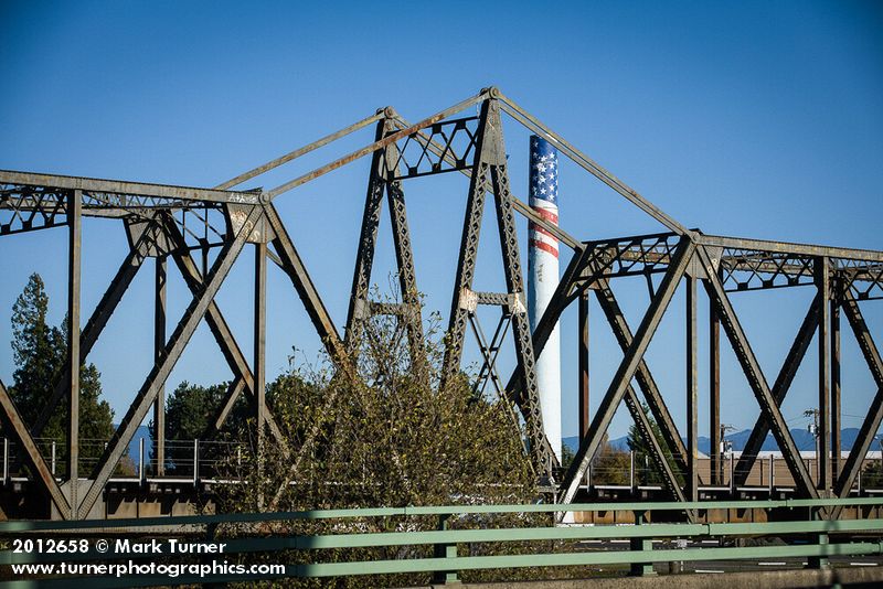 Ferndale Carnation Condensary smokestack framed by BNSF railroad bridge. Ferndale, WA. © Mark Turner [2012658]