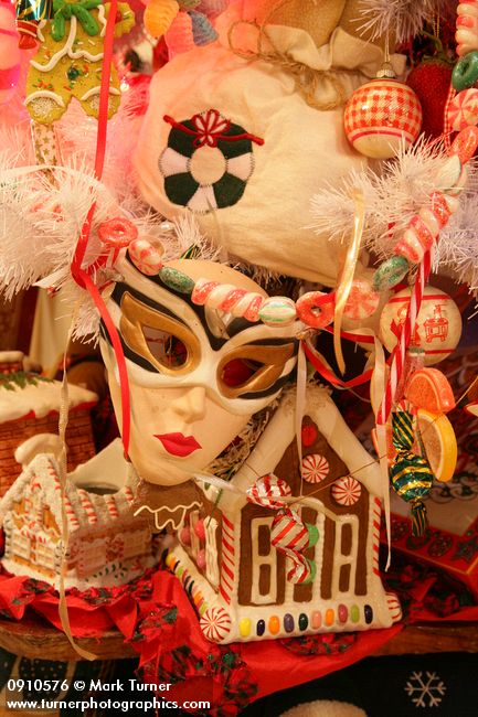 0910576 Mask & gingerbread house ornaments on Gingerbread & Candy Christmas tree. Mary Etta Foster, Ferndale, WA. © Mark Turner