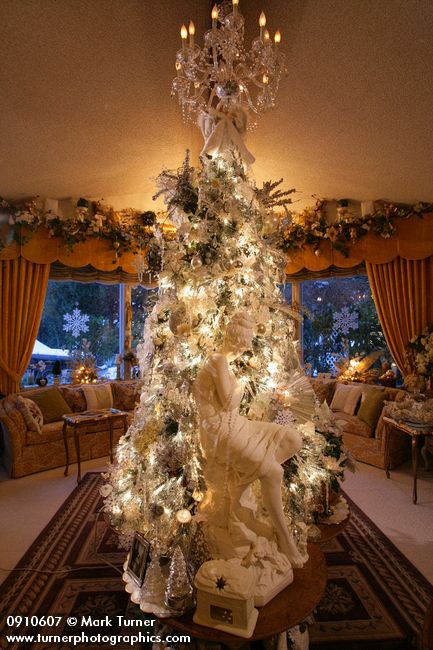 0910607 Silver Christmas tree w/ classical nymph statue in living room. Mary Etta Foster, Ferndale, WA. © Mark Turner