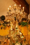 0910674 Chandelier & angel doll atop Gold Christmas tree. Mary Etta Foster, Ferndale, WA. © Mark Turner