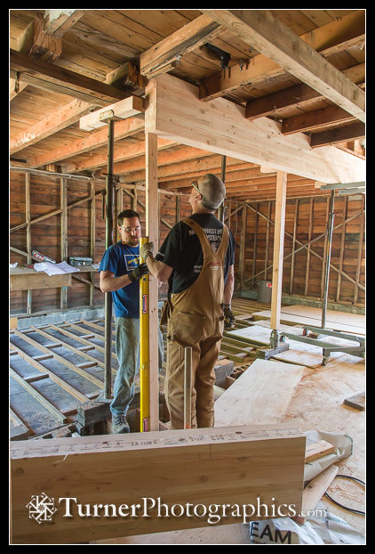Mike Gill and Dennis check horizontal position of glulam