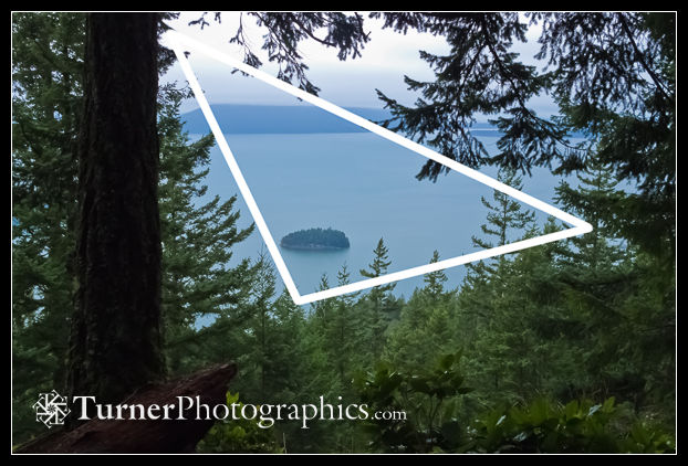 A triangle forms the frame around the main subject in a landscape.