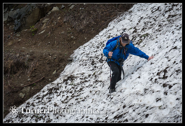 Brian Small crosses steep snow