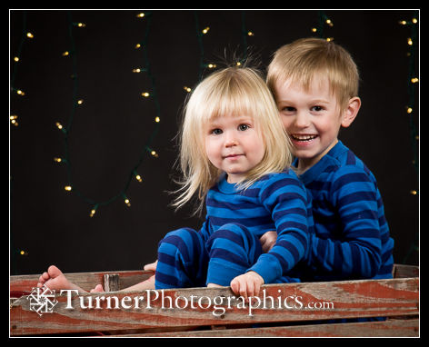 Miles (4), and Sophia (2) Ennen portrait. Bellingham, WA. © 2020 Mark Turner Two children in wagon