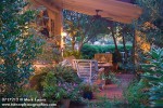 0717212 Covered outdoor sitting area w/ ferns, Impatiens, Basil fgnd, dusk [Impatiens walleriana; Ocimum basilicum]. Turman, Oklahoma City, OK. © Mark Turner